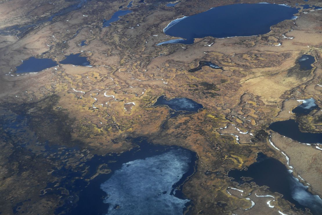 An aerial view shows melting permafrost tundra on the Yukon Delta in Alaska. The Arctic has been warming more than twice as fast as the rest of the planet, triggering a host of changes across the region.