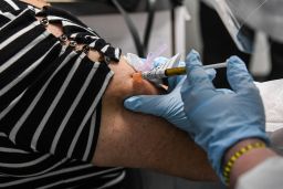 Sandra Rodriguez, 63, receives a Covid-19 vaccination on August 13 at the Research Centers of America in Hollywood, Florida, as part of Phase 3 clinical trials.