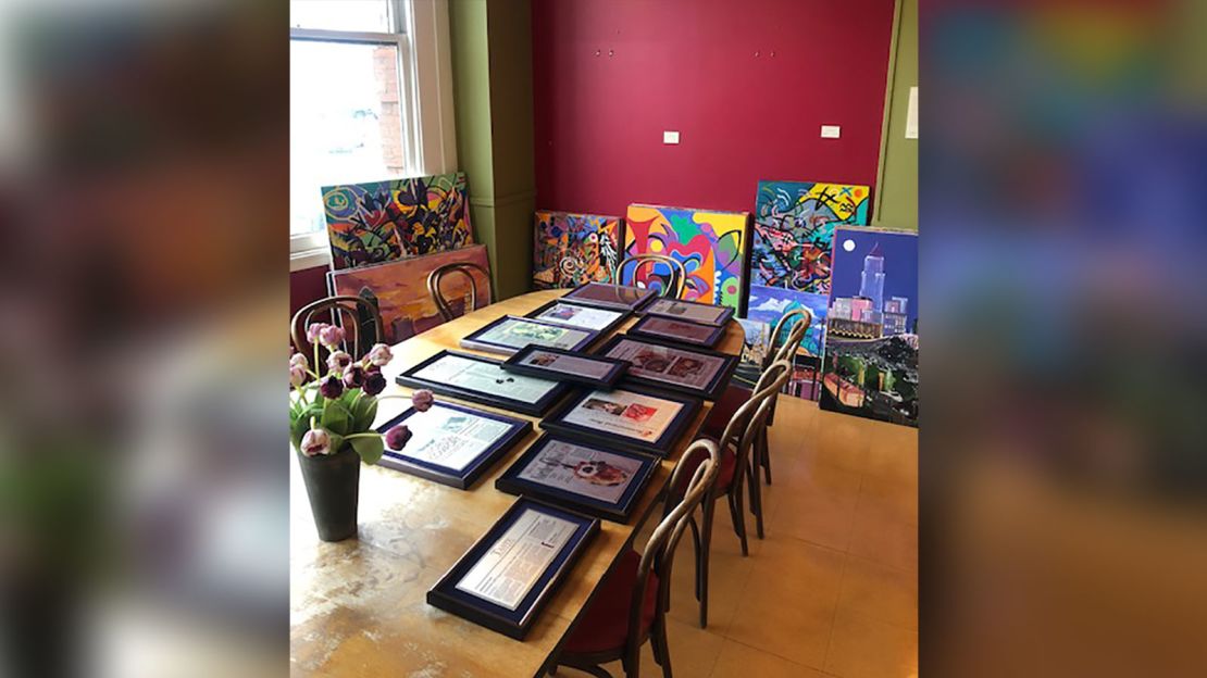Stacks of artwork from Tastebuds getting packed up on the last day.