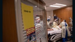 A "prone team," wearing personal protective equipment (PPE), prepares to turn a COVID-19 patient onto his stomach in a Stamford Hospital intensive care unit (ICU), on April 24, 2020 in Stamford, Connecticut. 