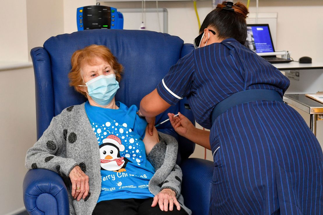 A nurse administers the Pfizer-BioNTech Covid-19 vaccine to Margaret Keenan.