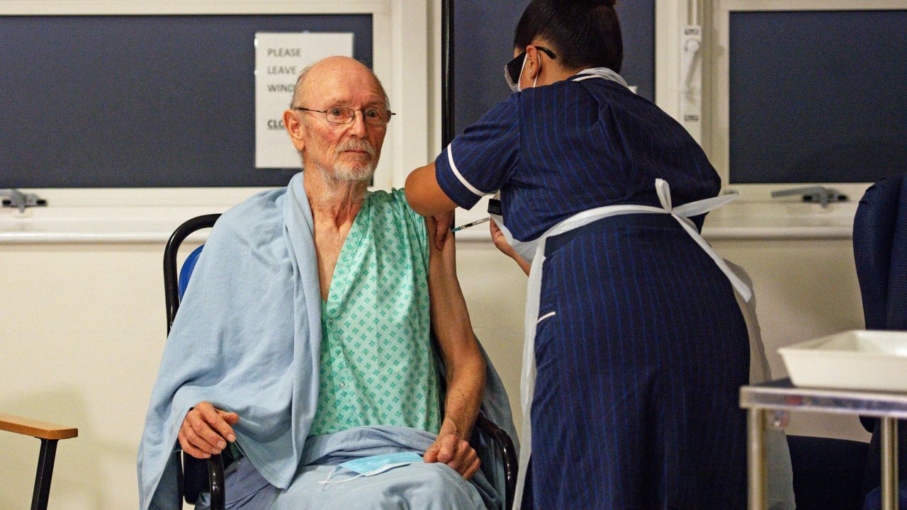 "Bill" William Shakespeare, 81, receives the Pfizer-BioNTech COVID-19 vaccine, at University Hospital, Coventry, England, Tuesday Dec. 8, 2020. The United Kingdom, one of the countries hardest hit by the coronavirus, is beginning its vaccination campaign, a key step toward eventually ending the pandemic. (Jacob King/Pool via AP)