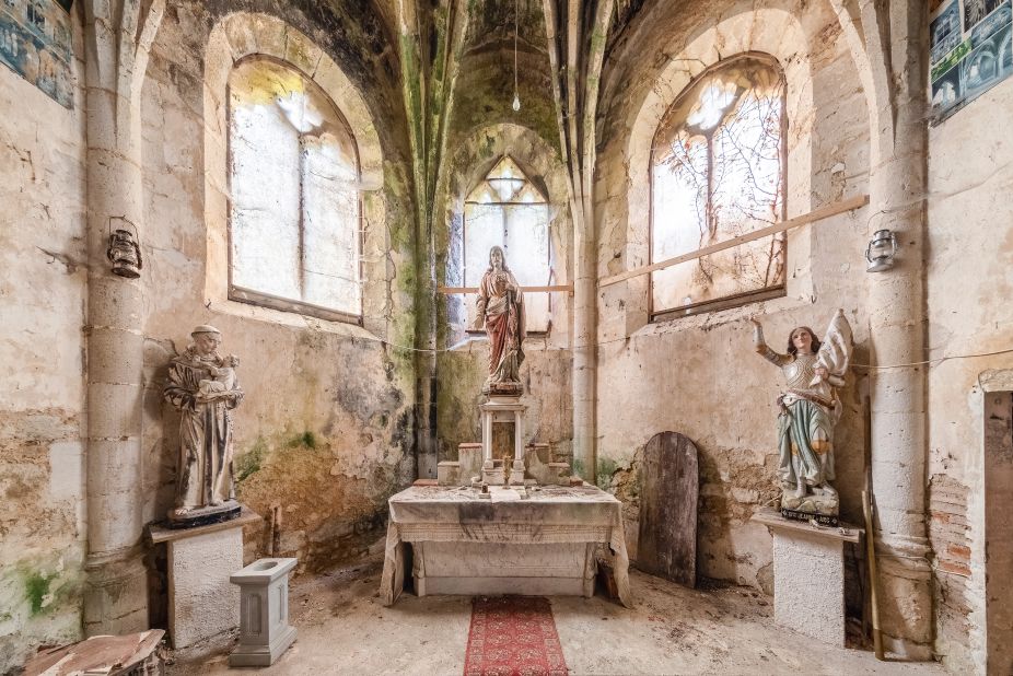 Figures depicting Saint Anthony of Padua (left), Jesus Christ (center) and Joan of Arc (right) at an abandoned church in France. Scroll through the gallery to see more of Francis Meslet's images of abandoned churches. 