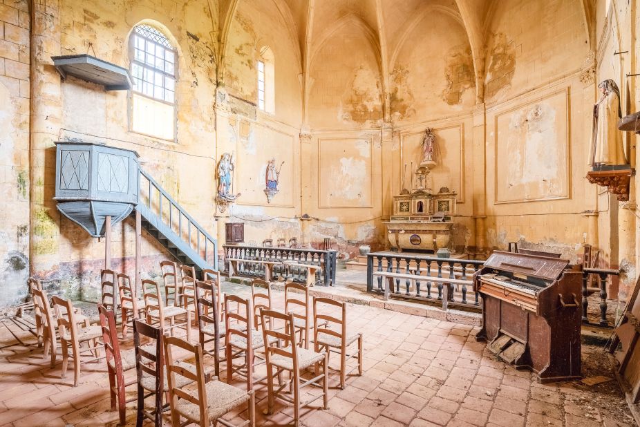 Wooden chairs still stand at a forgotten church in France's Nouvelle-Aquitaine region.