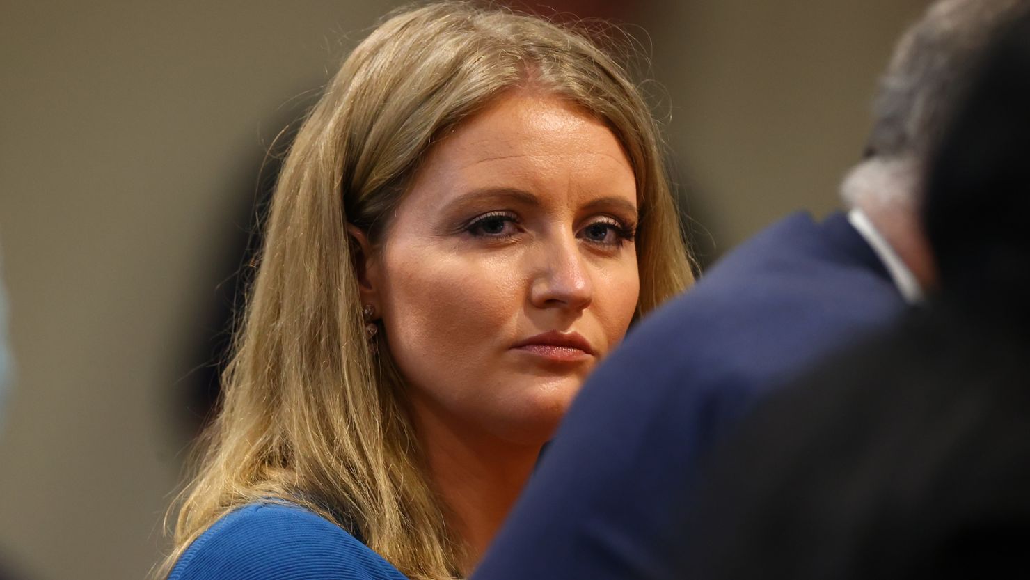 Jenna Ellis, a member of President Donald Trump's legal team, listens to Detroit poll worker Jessi Jacobs during an appearance before the Michigan House Oversight Committee on December 2, 2020 in Lansing, Michigan.