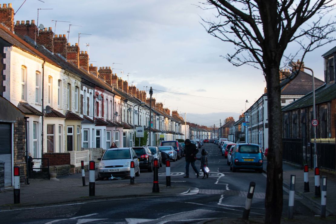 People cross a street in Cardiff, Wales, as operations for the roll-out of the first Pfizer/BioNTech Covid-19 vaccinations gets underway on Tuesday.