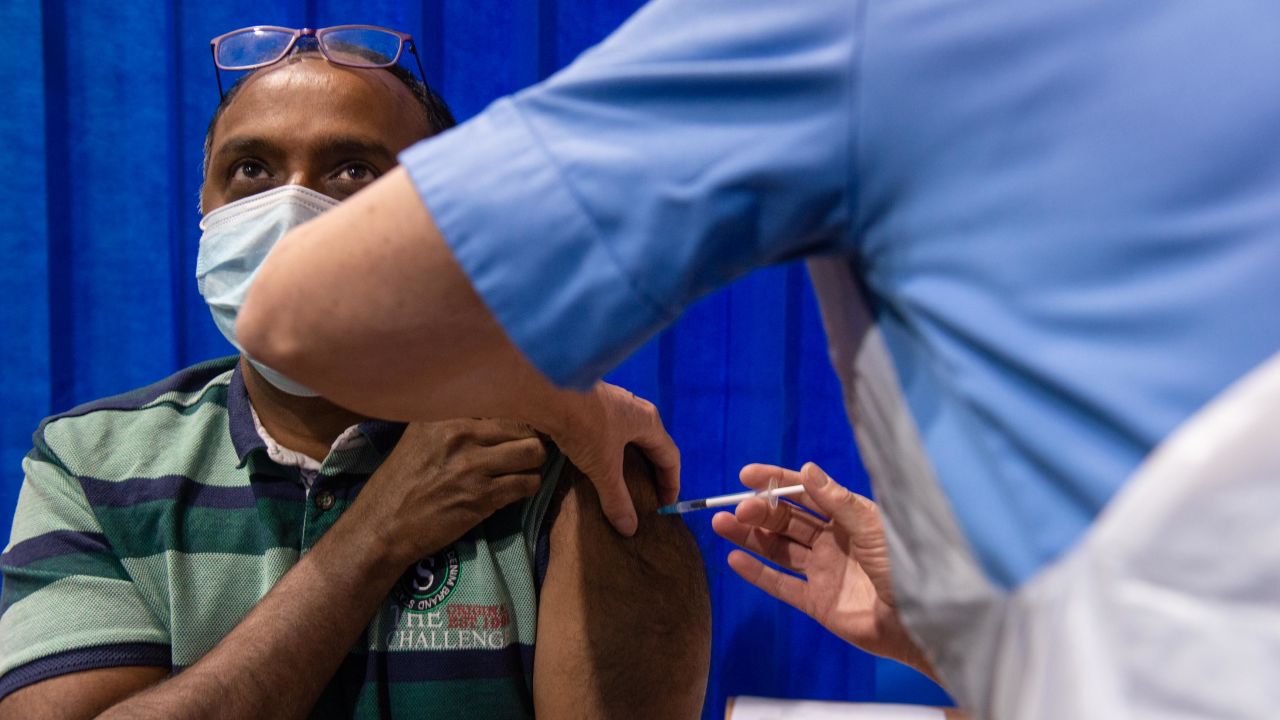 Venkat Chandra receives the Pfizer/BioNTech Covid-19 vaccine at a health center in Cardiff on Tuesday.