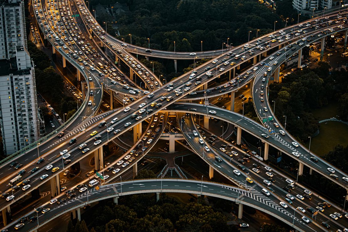 Vehicles are driven along the Yan'an Elevated Road in Shanghai, China. A new study finds that the mass of materials embedded in our roads, cars and much more may now exceed the overall weight of all biomass on Earth.