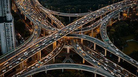 Vehicles are driven along the Yan'an Elevated Road in Shanghai, China. A new study finds that the mass of materials embedded in our roads, cars and much more may now exceed the overall weight of all biomass on Earth.