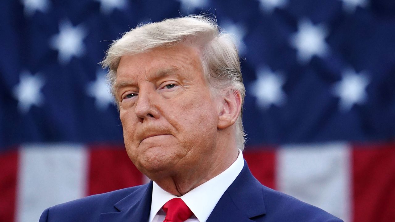 TOPSHOT - US President Donald Trump looks on after delivering an update on "Operation Warp Speed" in the Rose Garden of the White House in Washington, DC on November 13, 2020. (Photo by MANDEL NGAN / AFP) (Photo by MANDEL NGAN/AFP via Getty Images)