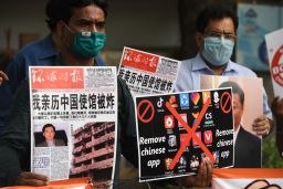 Members of the Working Journalist of India hold placards urging citizens to remove Chinese apps and stop using Chinese products during a demonstration in June.
