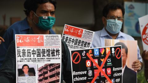 Members of the Working Journalist of India hold placards urging citizens to remove Chinese apps and stop using Chinese products during a demonstration in June.