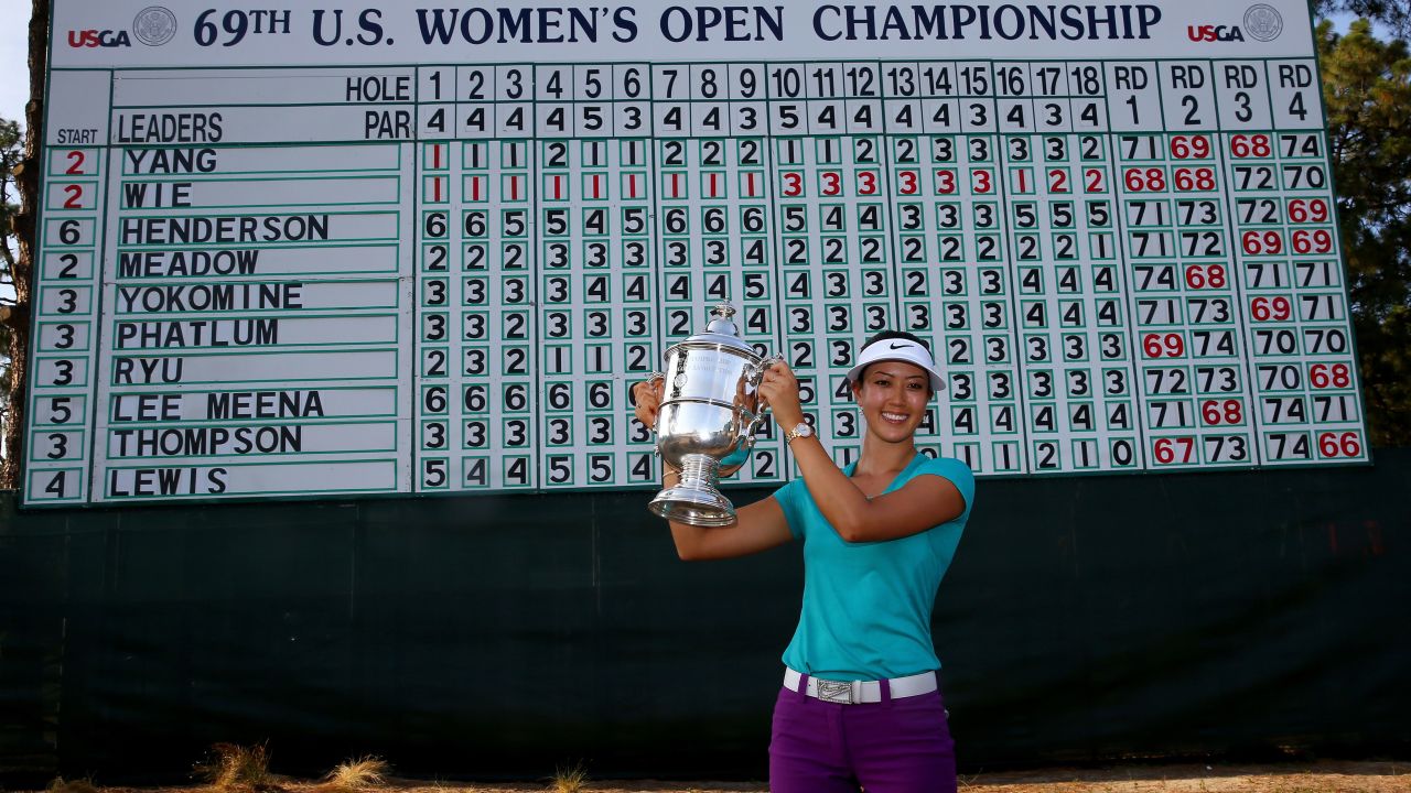 Wie celebrates with the trophy after winning in the final round of the 69th U.S. Women's Open in 2014.
