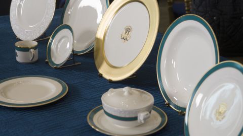 The Obama State China service, designed with the assistance of First Lady Michelle Obama, is seen in the State Dining Room of the White House in April 2015. 