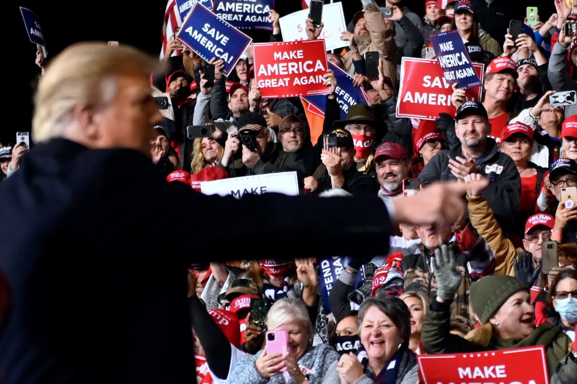 US President Donald Trump gestures after speaking at a rally in Valdosta, Georgia, on Saturday, December 5. Trump was campaigning for the two Republican candidates in the state's US Senate runoffs.