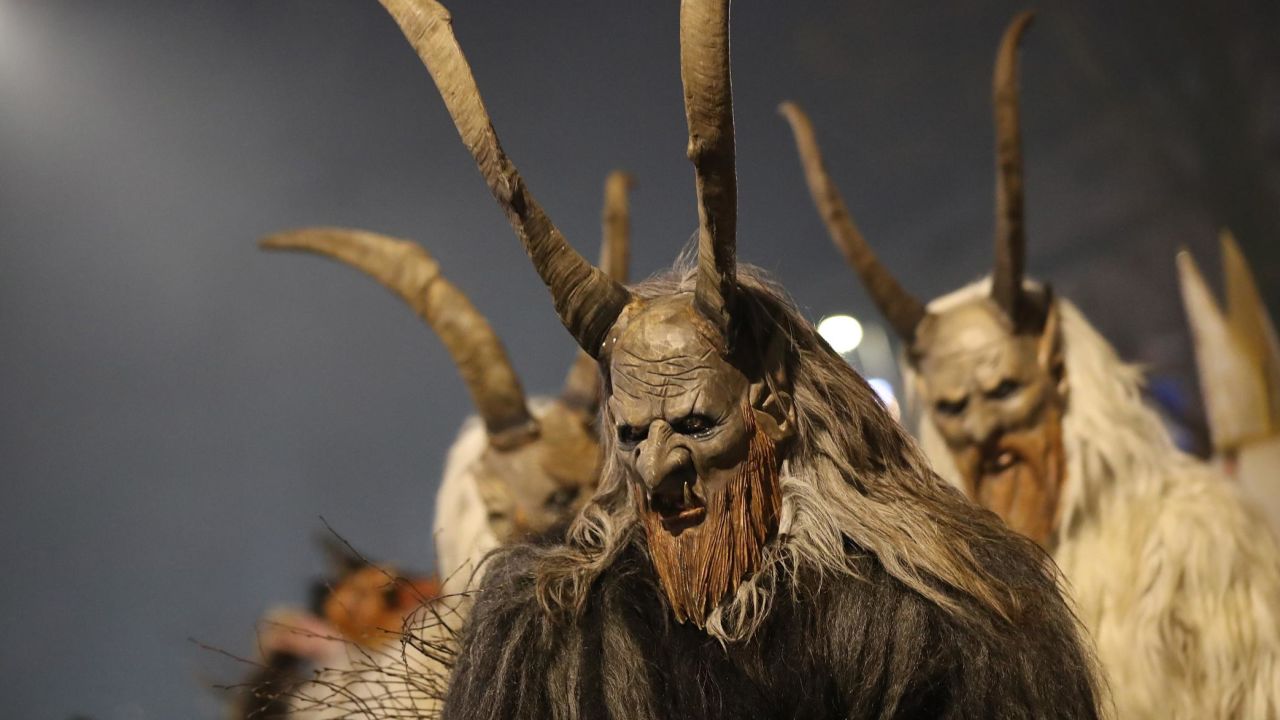 Men wearing horned, wooden masks participate in the annual Krampus parade on Saint Nicholas Day December 6, 2017, in Sankt Johann im Pongau, Austria.