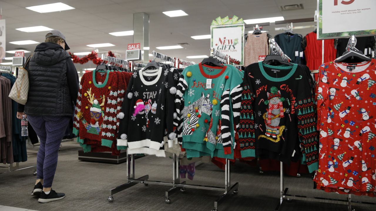 A shopper eyes ugly Christmas sweaters at a Kohl's ahead of Black Friday, November 27, 2019, in Las Vegas. 