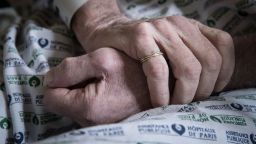 The hands of a male patient infected with Covid-19 is pictured at Henri Vidal Hospital AP-HP in Paris on April 27.