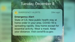California authorities sent this cellphone text alert to two major regions of the state to tell millions of people that the coronavirus is spreading rapidly and ask them to stay home except for essential activities. The noon Tuesday, Dec. 8, 2020, blast to the state-designated 11-county Southern California region and 12-county San Joaquin Valley region was sent by the Office of Emergency Services. The text also urged people to wear masks and to physically distance. Both regions came under increased restrictions this week after the total capacity of hospital intensive care units dropped below 15%. The restrictions will remain in effect for at least three weeks. (State of California via AP)