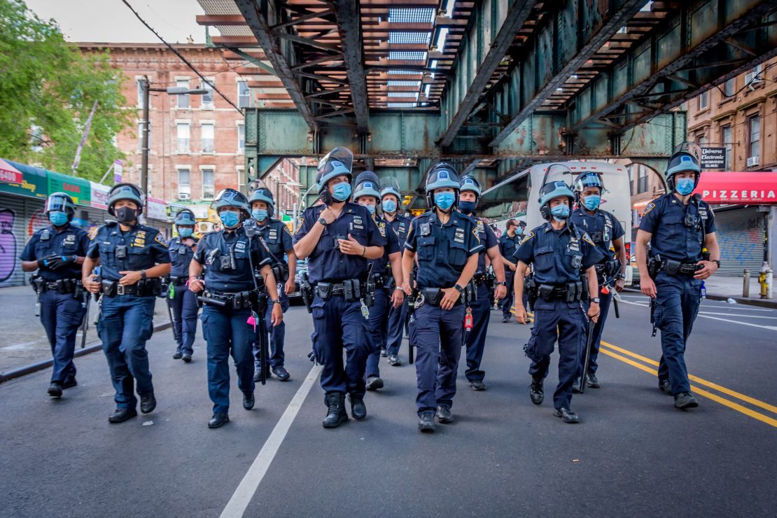 Police in Brooklyn turn out in response to a massive march in June, demanding justice for all victims of police brutality, making a loud call to defund the NYPD and invest in communities.