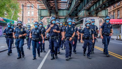 Police in Brooklyn turn out in response to a massive march in June, demanding justice for all victims of police brutality, making a loud call to defund the NYPD and invest in communities. 