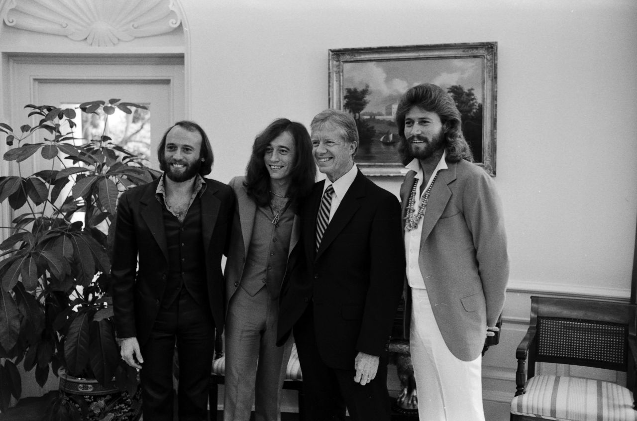 Carter's cool rep extended beyond jazz, rock and soul and right into disco. When the Bee Gees were in Washington for a concert in the fall of 1979, <a href="https://twitter.com/BeeGees/status/1196884600024379392/photo/2" target="_blank" target="_blank">the group requested to meet Carter</a> and captured this photo. 