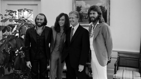Carter's cool rep extended beyond jazz, rock and soul and right into disco. When the Bee Gees were in Washington for a concert in the fall of 1979, <a href="https://twitter.com/BeeGees/status/1196884600024379392/photo/2" target="_blank" target="_blank">the group requested to meet Carter</a> and captured this photo. 