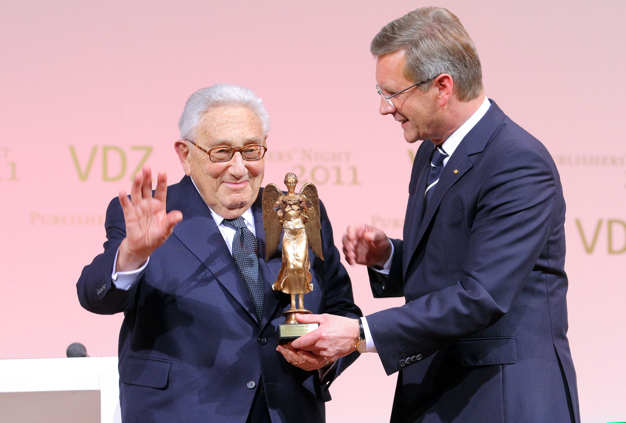 Kissinger receives a Golden Victoria Award from German President Christian Wulff in Berlin in 2011.