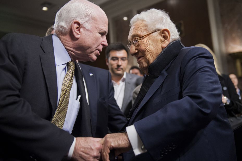 Kissinger is greeted by US Sen. John McCain after a Senate Armed Services Committee hearing in 2015.