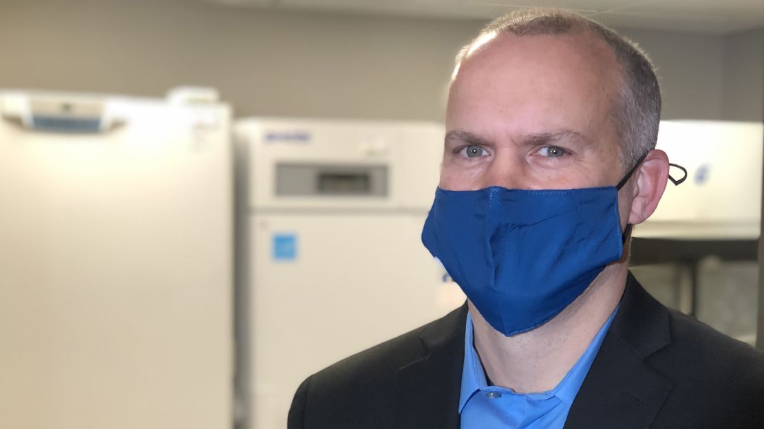 Jesse Breidenbach, Senior Executive Director of Pharmacy at Sanford Health, standing in front of their ultracold freezers.