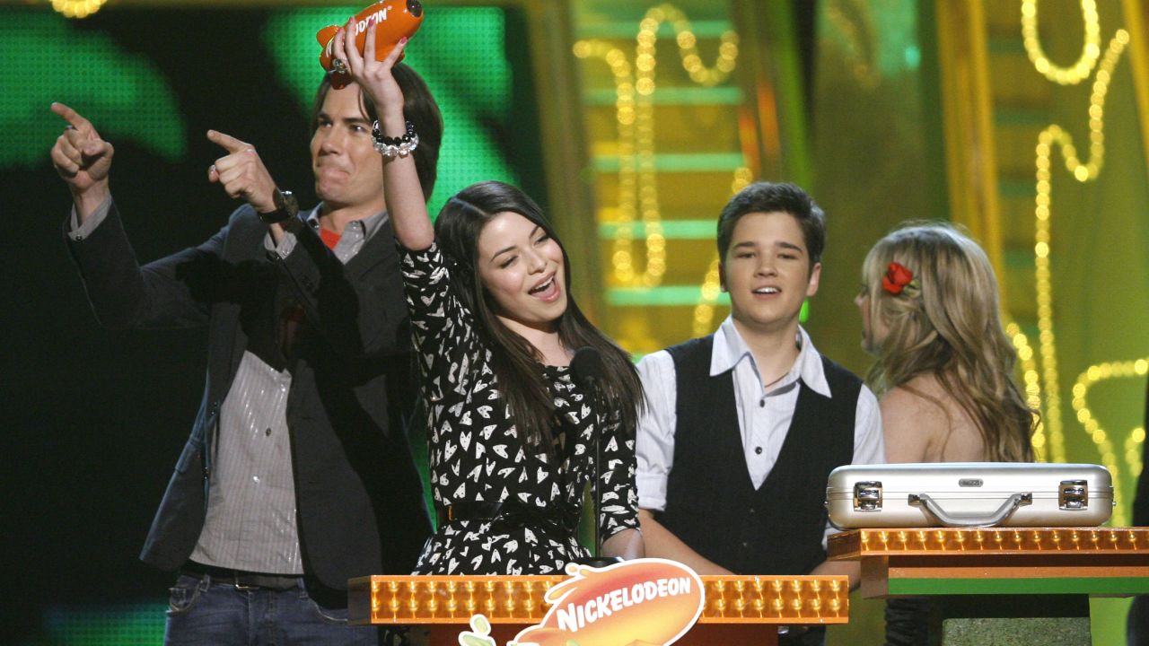 Miranda Cosgrove accepts the award for favorite television actress for "iCarly" at the 22nd Annual Kids' Choice Awards Saturday, March 28, 2009, in Los Angeles. Actors Jerry Trainor, Nathan Kress and Jennette McCurdy are in the background. (Jason DeCrow/AP Images for Nickelodeon)