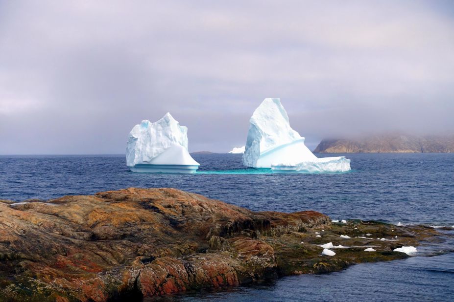 An iceberg "calved" off the Greenland ice sheet, floating along the coast of Upernavik, Greenland, in 2018. Ice melt has accelerated rapidly since the 1990s and Greenland lost more ice <a href="https://edition.cnn.com/2020/09/30/weather/greenland-ice-sheet-melt-carbon-emissions-climate-change/index.html" target="_blank">during 2019</a> than in any year on record.