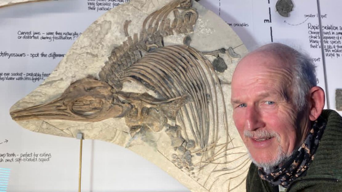 Steve Etches pictured with a drawing of the newly identified Thalassodraco etchesi.