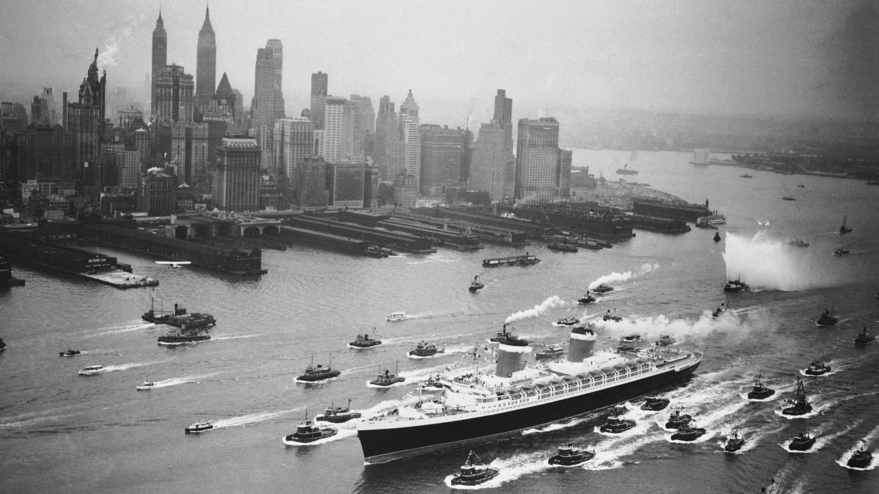 <strong>A New York welcome: </strong>A huge cordon of tugs accompanies the SS United States past the New York skyline on her maiden outing. 