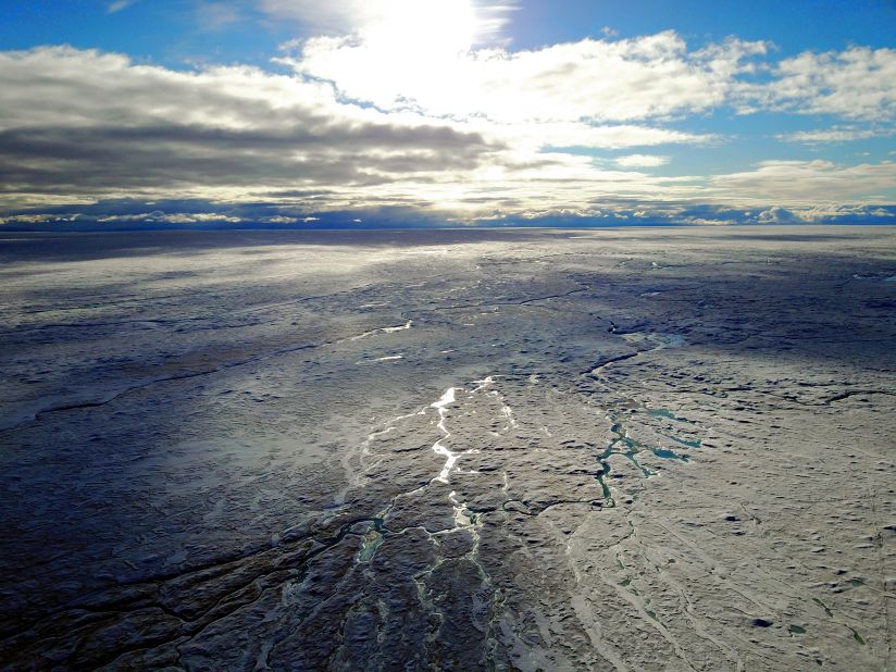 Greenland's ice sheet is the single biggest contributor to global sea level rise and recent studies show it's melting faster than expected. Here, on the ice sheet's southwestern side (pictured in summer 2017), water generated by melting ice carves rivers into the surface. 