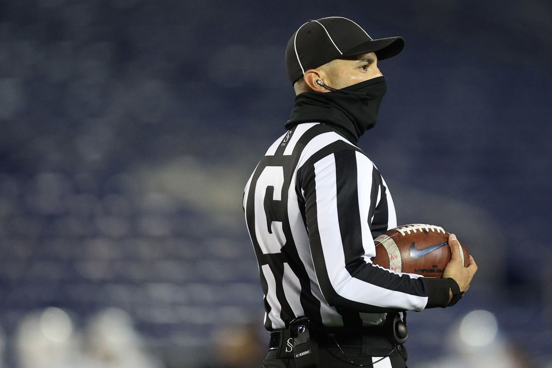 A college football referee wears a face covering due to Covid-19 pandemic during the second half at Navy-Marine Corps Memorial Stadium on November 28, 2020 in Annapolis, Maryland. 