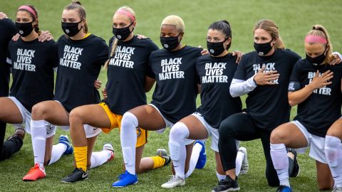 Utah Royals FC players wearing shirts in support for the Black Lives Matter movement kneel prior a game between Utah Royals FC and Houston Dash at Zions Bank Stadium on June 30, 2020.