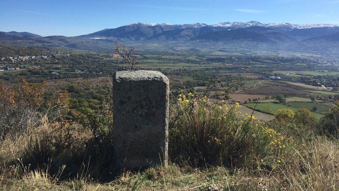 This photo was taken in Spain, but France lies beyond the border marker.