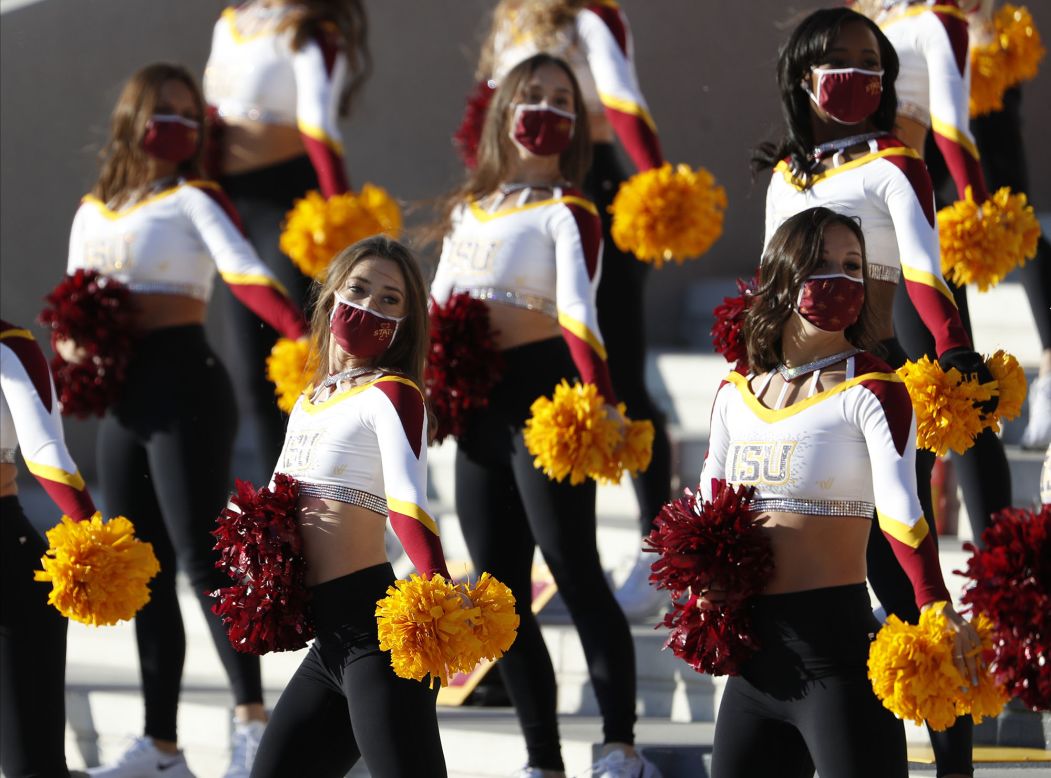 Members of the Iowa State dance team perform during the university's football game against West Virginia on Saturday, December 5.