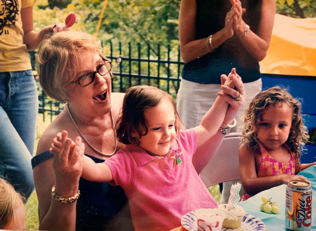 Betsy in 2001 celebrating the third birthday of her niece in Concord, NC, with ice cream and cupcakes.