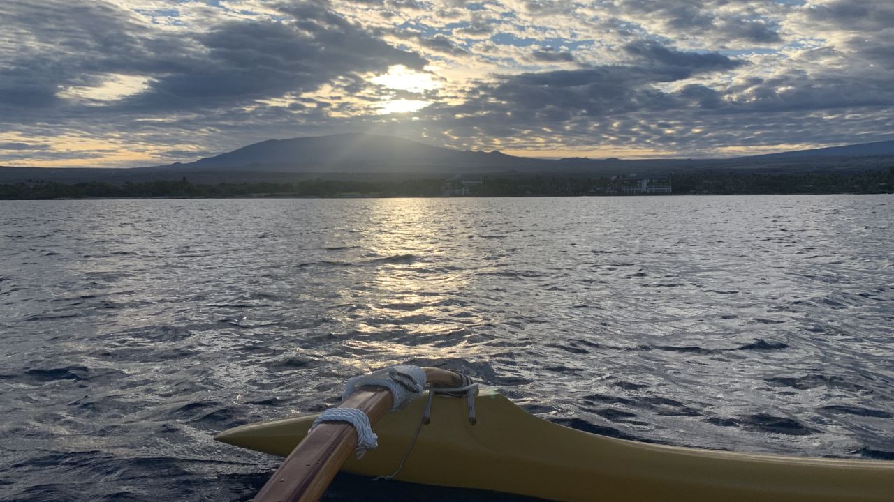Watch the sunrise over Mauna Kea from an outrigger canoe.