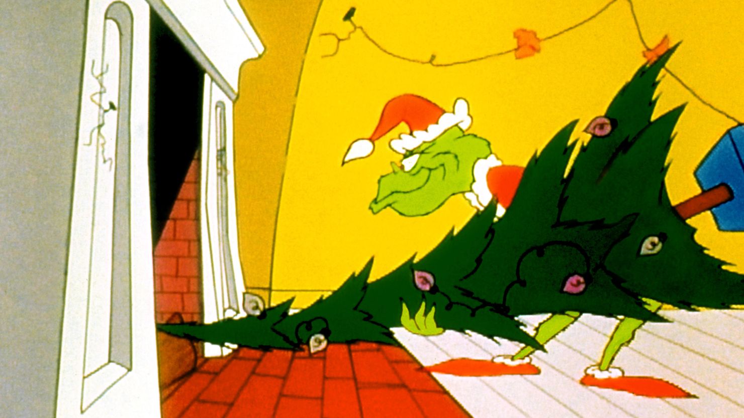 The Grinch sends a tree up the chimney during his raid on Whoville in the 1966 cartoon classic, "How the Grinch Stole Christmas."
