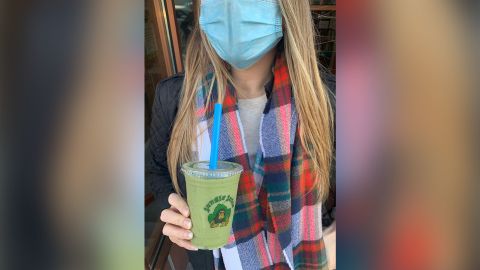 Julie Spero models a mask while holding a smoothie. New Jersey's PSA campaign wasn't limited to influencers but included Instagram food blogs like Spero's which is known as Hoboken Hungry.
