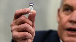 Wesley Wheeler, President of Global Healthcare at United Parcel Service (UPS), holds up a sample of the vial that will be used to transport the Pfizer COVID-19 vaccine as he testifies during a Senate Commerce, Science, and Transportation Subcommittee hearing on the logistics of transporting a COVID-19 vaccine on December 10, 2020 in Washington, DC. Once a vaccine is approved by the FDA, emergency approval of Pfizers Covid vaccine coming as early as today, the next hurdle is making sure the vaccine gets to where it is most needed. (Photo by Samuel Corum-Pool/Getty Images)