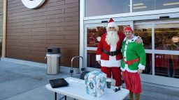 Undercover officers from the Riverside Police Department dressed as Santa and an elf to bust shoplifters and car thieves on December 10, 2020 in Riverside, California.