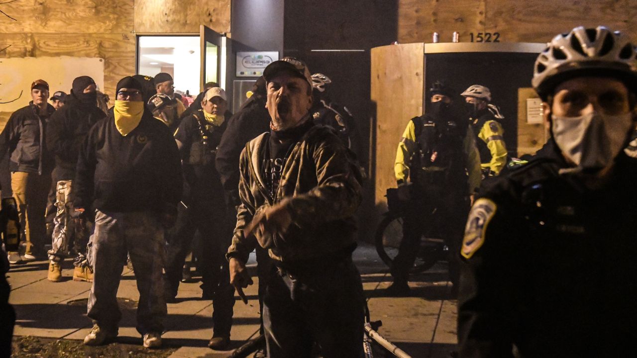 Members of the Proud Boys yell in front of a hotel during a protest on December 12 in Washington, DC.