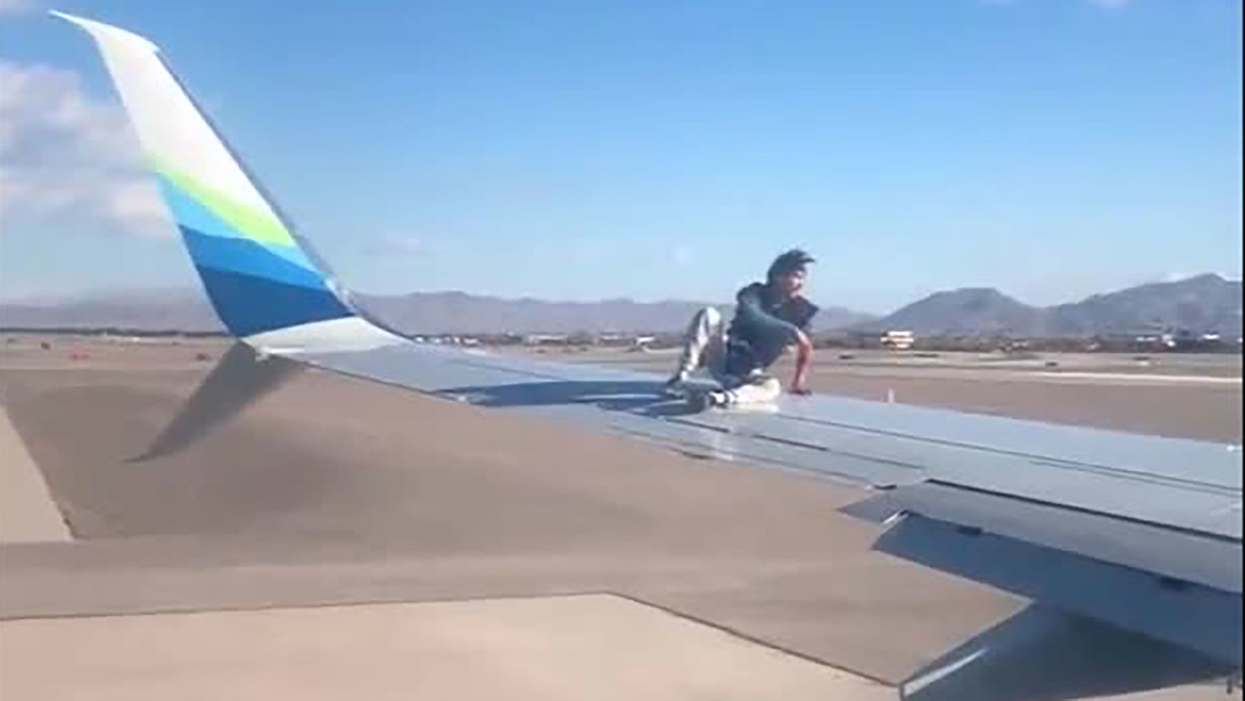 Las Vegas airport: Man taken into custody after he climbed onto