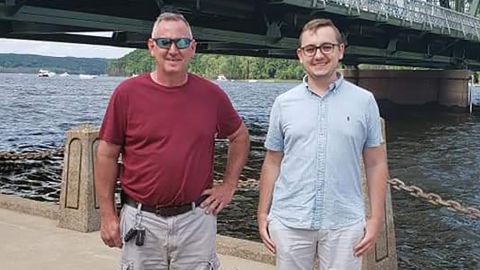 Tyler Skluzacek, right, created a smartwatch app to stop his father Patrick's nightmares.