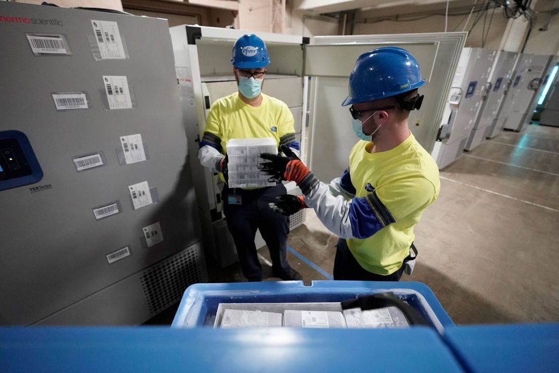 Boxes containing the Pfizer-BioNTech Covid-19 vaccine are prepared for shipping at the Pfizer Global Supply Kalamazoo manufacturing plant on December 13, 2020 in Michigan. 