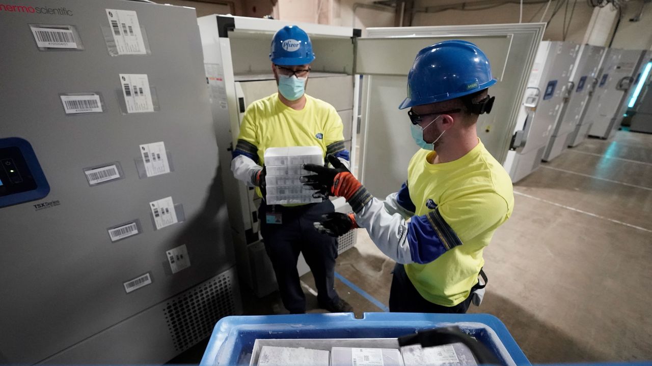 Boxes containing the Pfizer-BioNTech Covid-19 vaccine are prepared for shipping at the Pfizer Global Supply Kalamazoo manufacturing plant on December 13, 2020 in Michigan.
